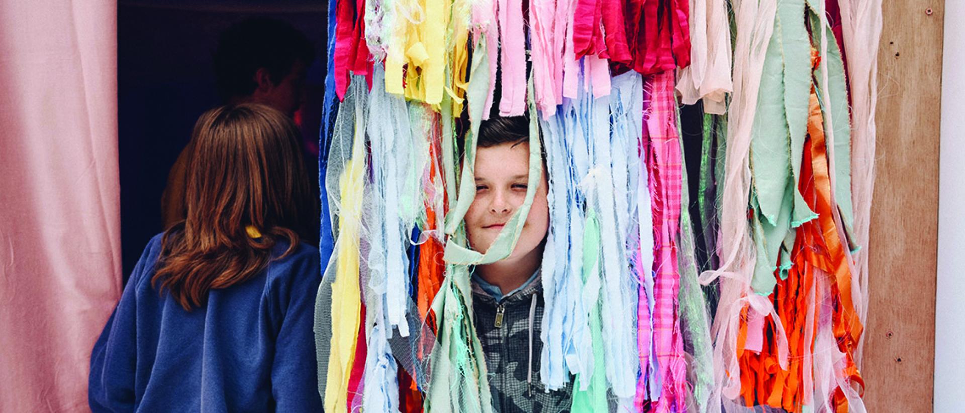 Children playing with colourful rags